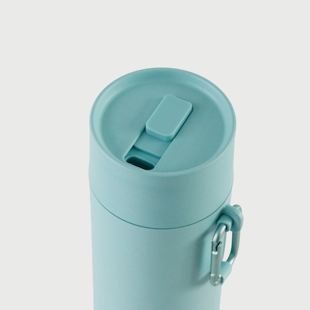 Slide to lock mouthpiece shown on S'wheat reusable bottle in blue