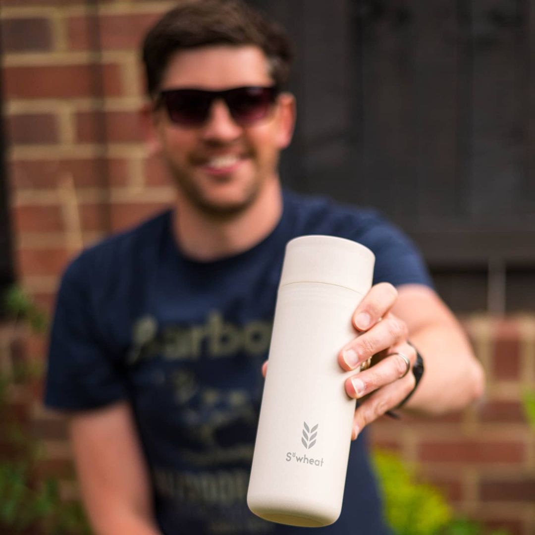 Man holding reusable drinks bottle