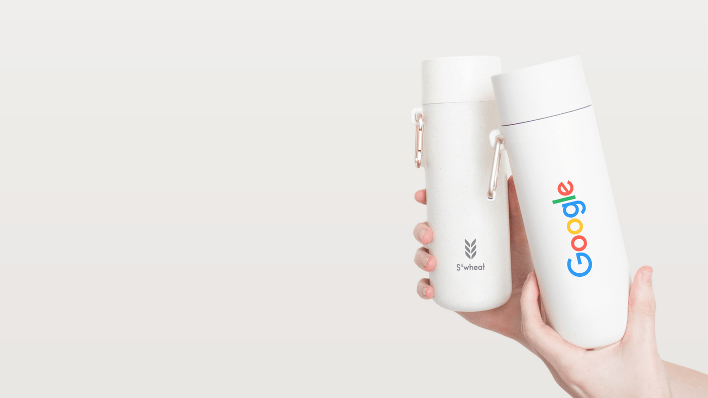 Two reusable water bottles being held up showing the co-branded bottles offerings
